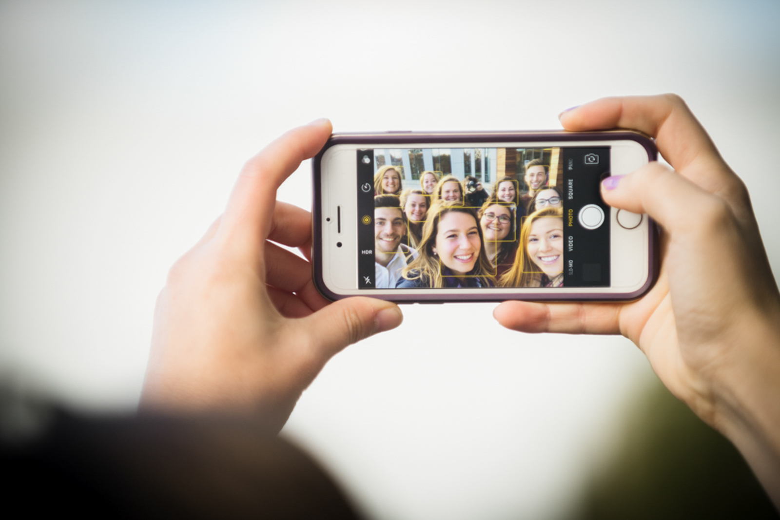 Photo os a group selfie taken on a cellphone