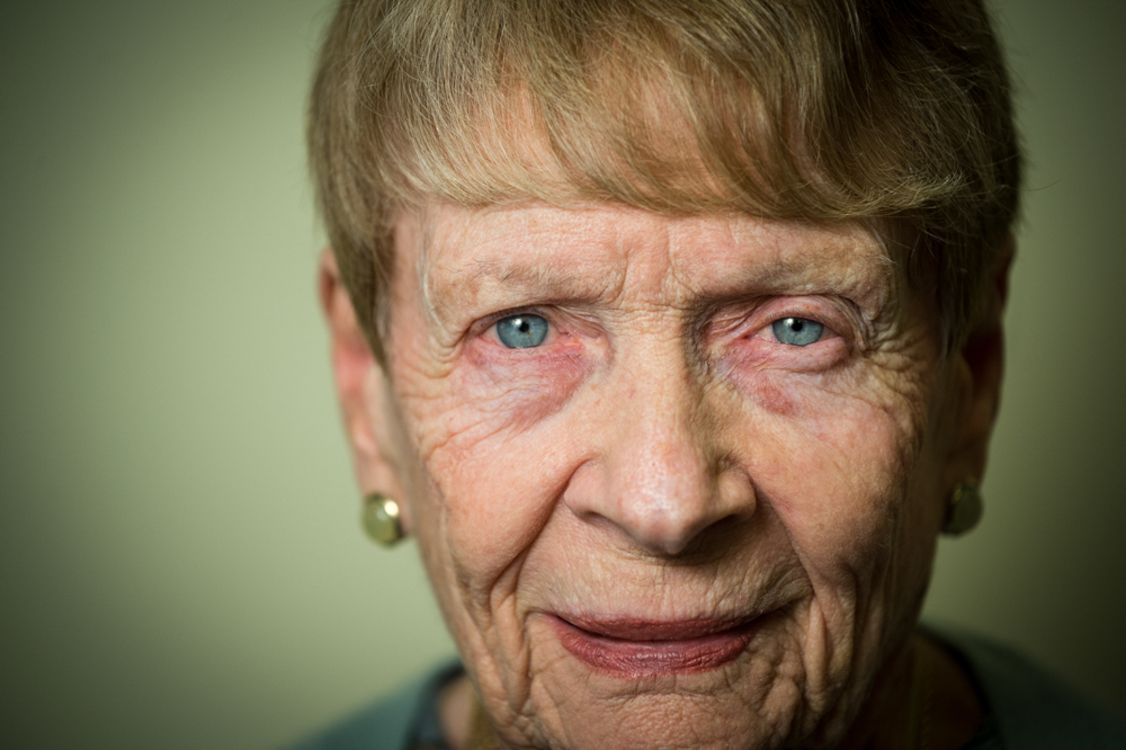 Portrait of elderly woman staring forward with peaceful expression