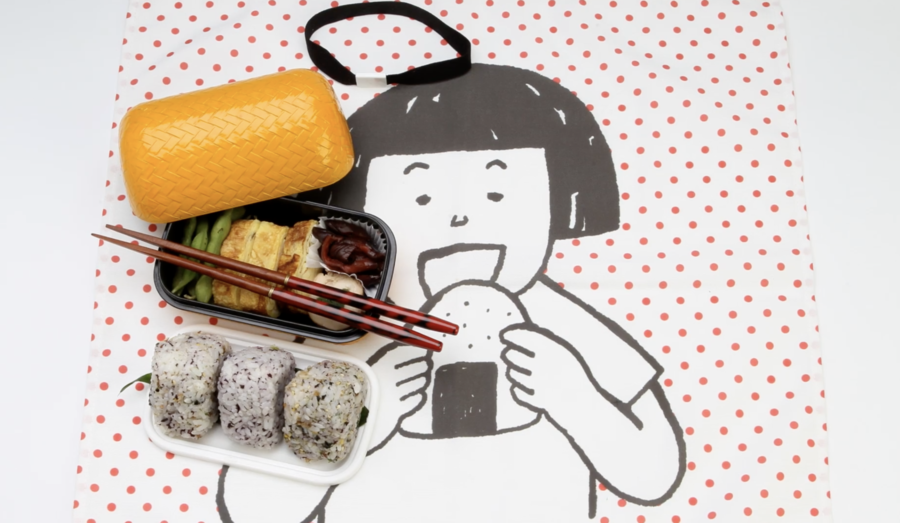 sushi with chopsticks on a table setting with cartoon of woman eating rice ball